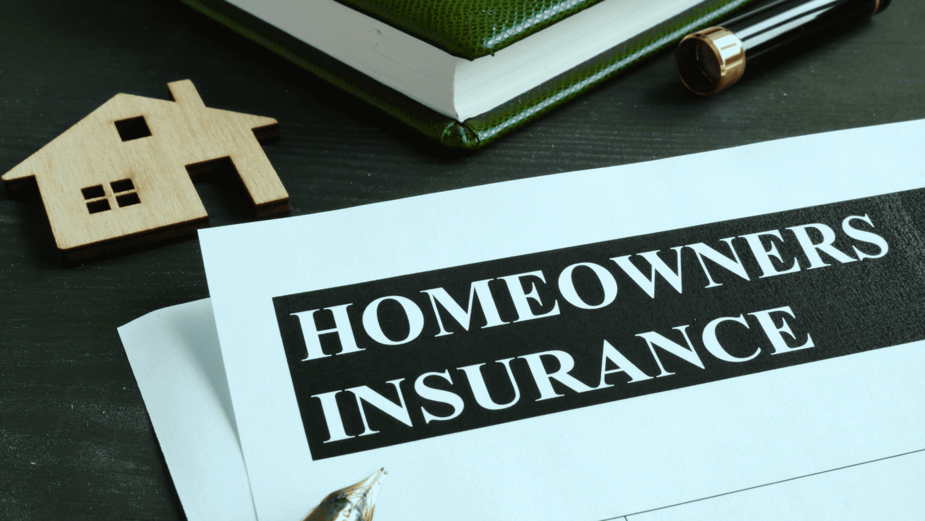 Homeowner's Insurance papers on a desk