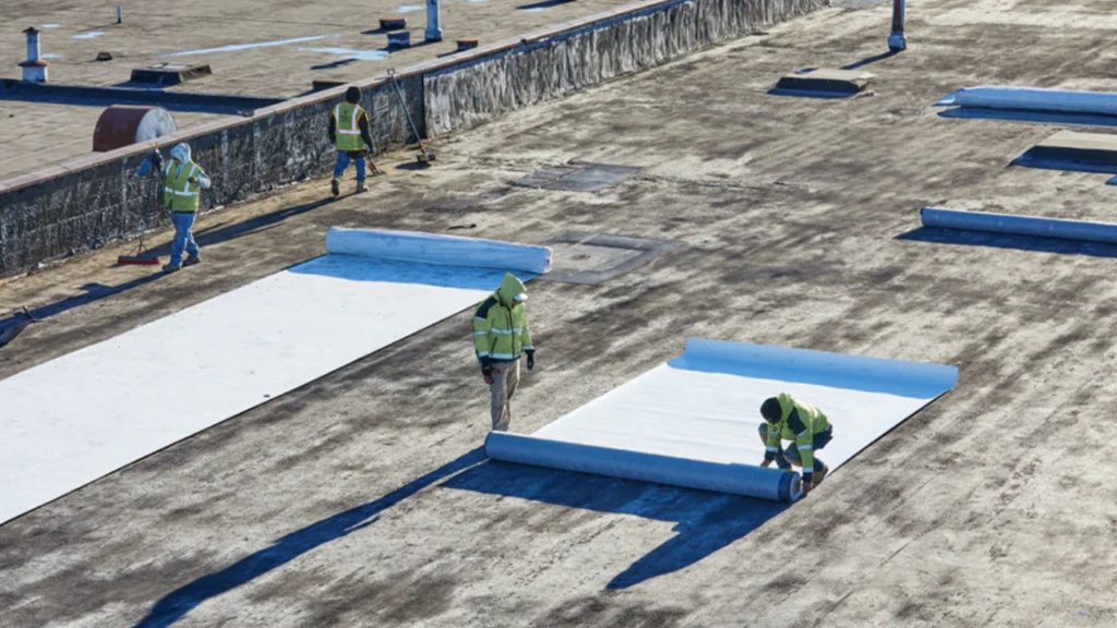 Commercial roofers installing new roof